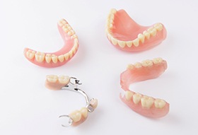 Several different types of dentures on a white background 