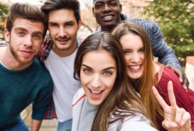Group of smiling young adults outdoors