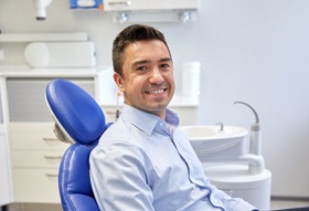Man with dental implants in Longview, TX sitting in dental chair