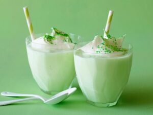 Green milkshakes on green background